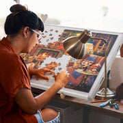 Person working on a puzzle with a stand