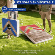 Two people standing on a grassy lawn demonstrate a portable cornhole board set. One board is shown upright with a blue and wood-grain design, and the other lies flat showing a red and wood-grain design.
