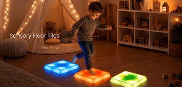 A child stands barefoot on glowing square floor tiles in a cozy children's room. One tile glows blue, one orange, and one green.